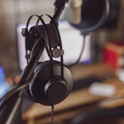 Excited serious professional using VR glasses for project developing. Man wearing virtual reality headset, touching air, gesturing. Interactive technology concept